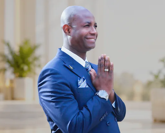 Bishop Johnny Belidor in a blue suit